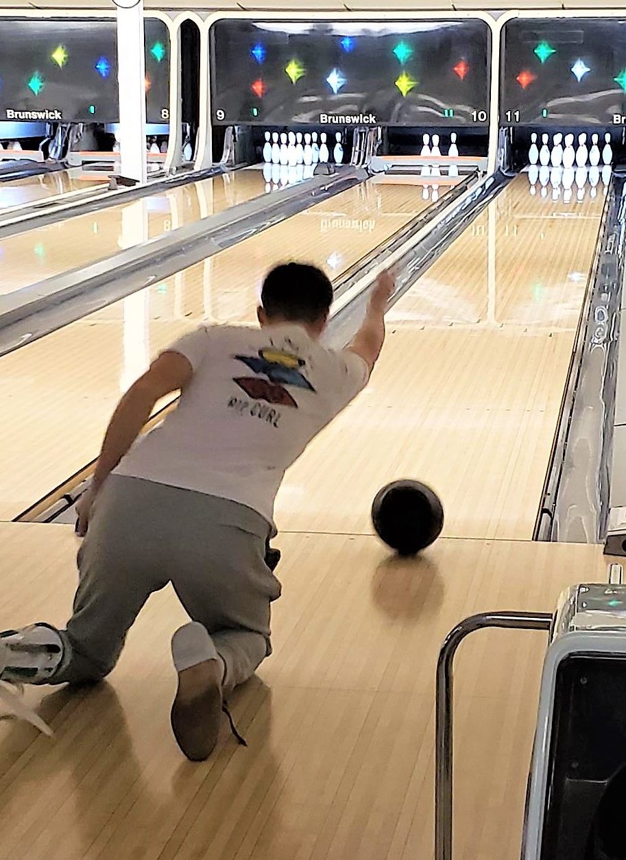 Bowler rolling a ball at the 2022 Bowl A Thon