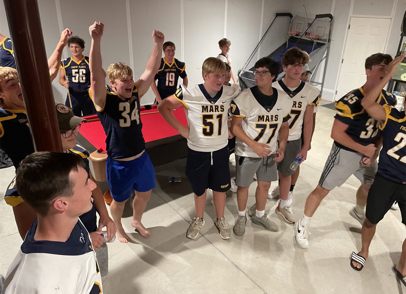 Mars Planets players cheering at the Community Drive