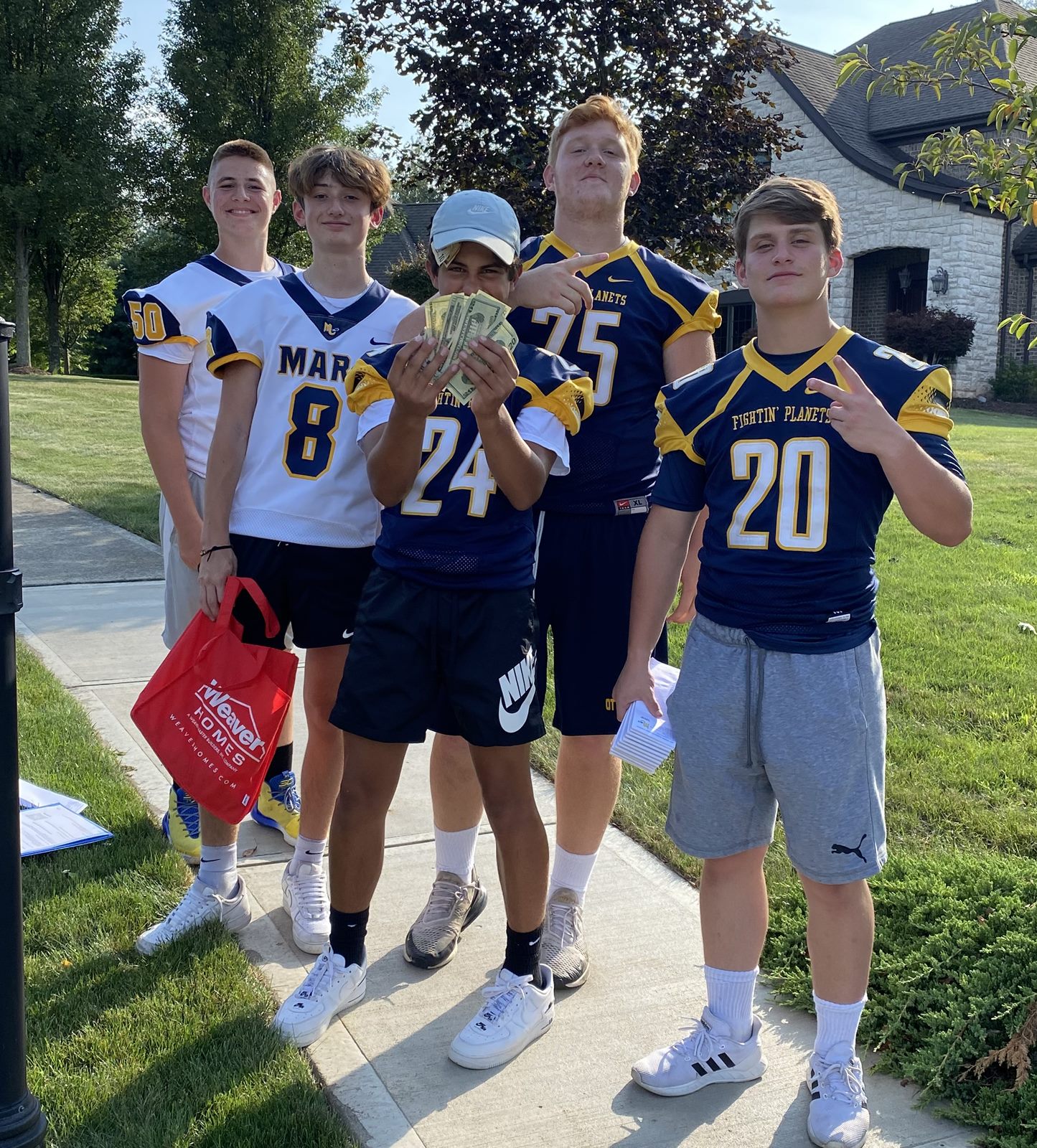 Mars Planets players in jerseys at the Community Drive