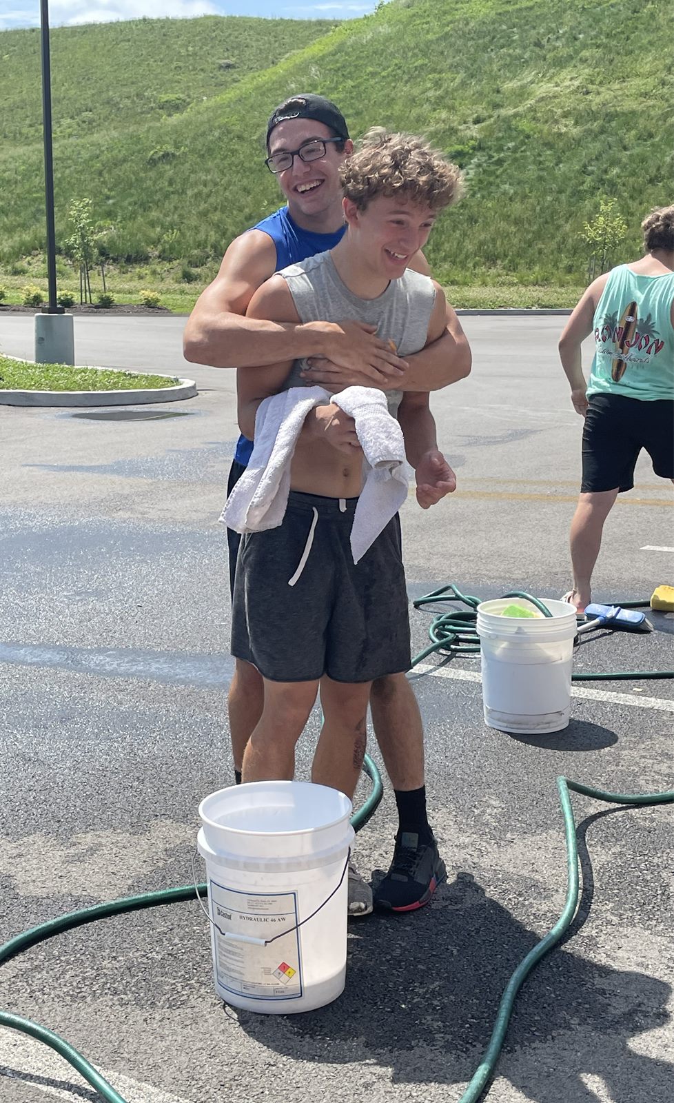Players at the Mars Quarterback Club car wash