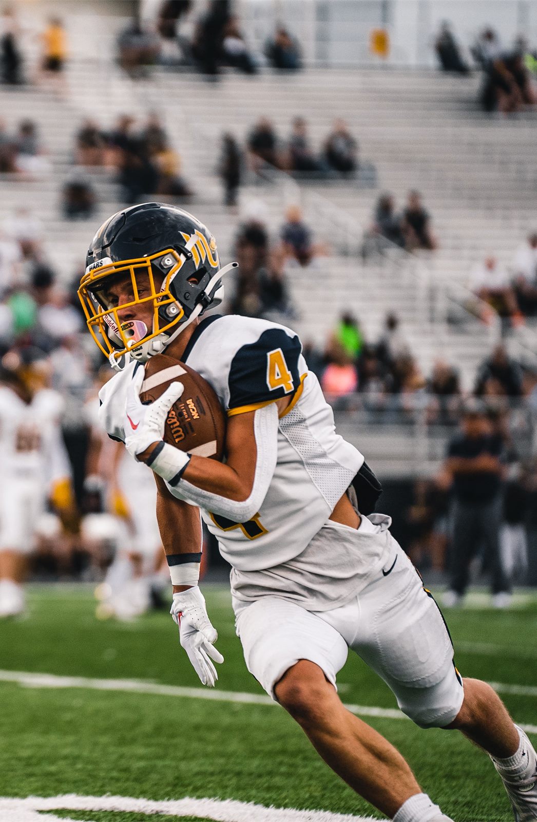 Mars Planets receiver making a catch against Montour