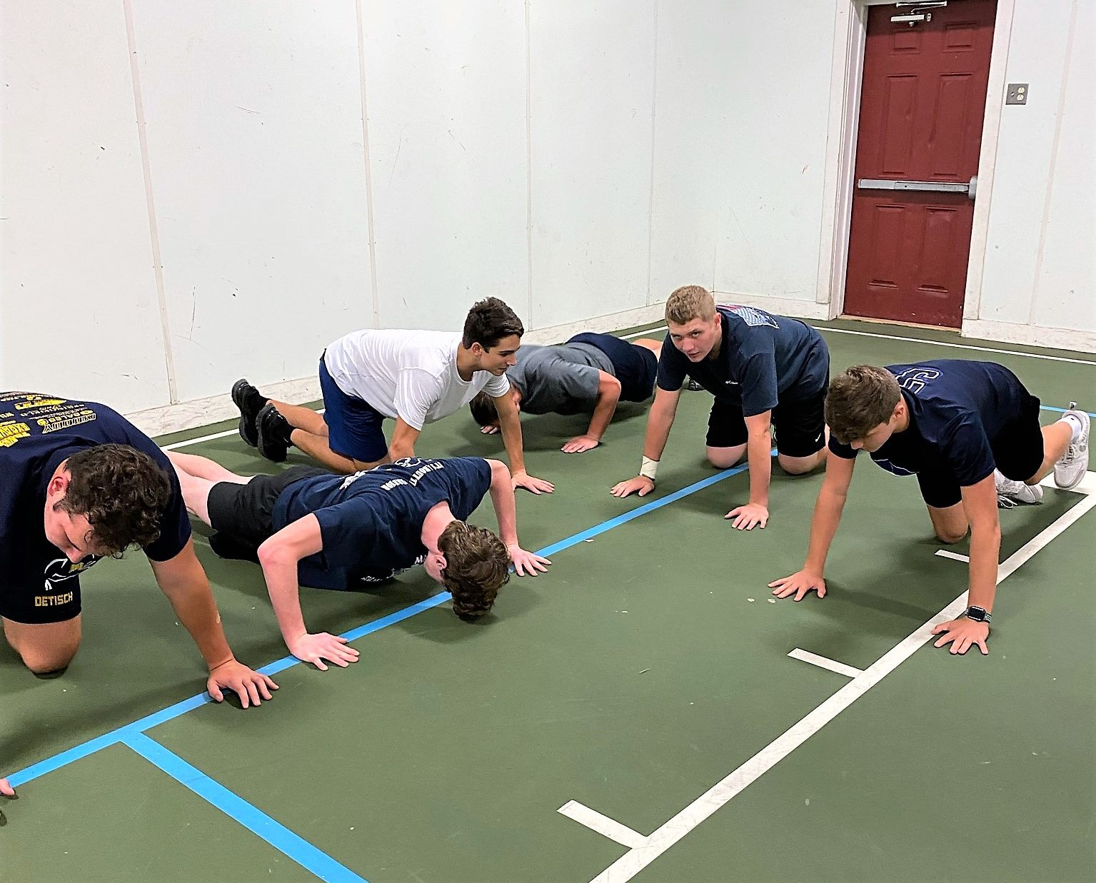 Players doing push ups at the Push Up Challenge