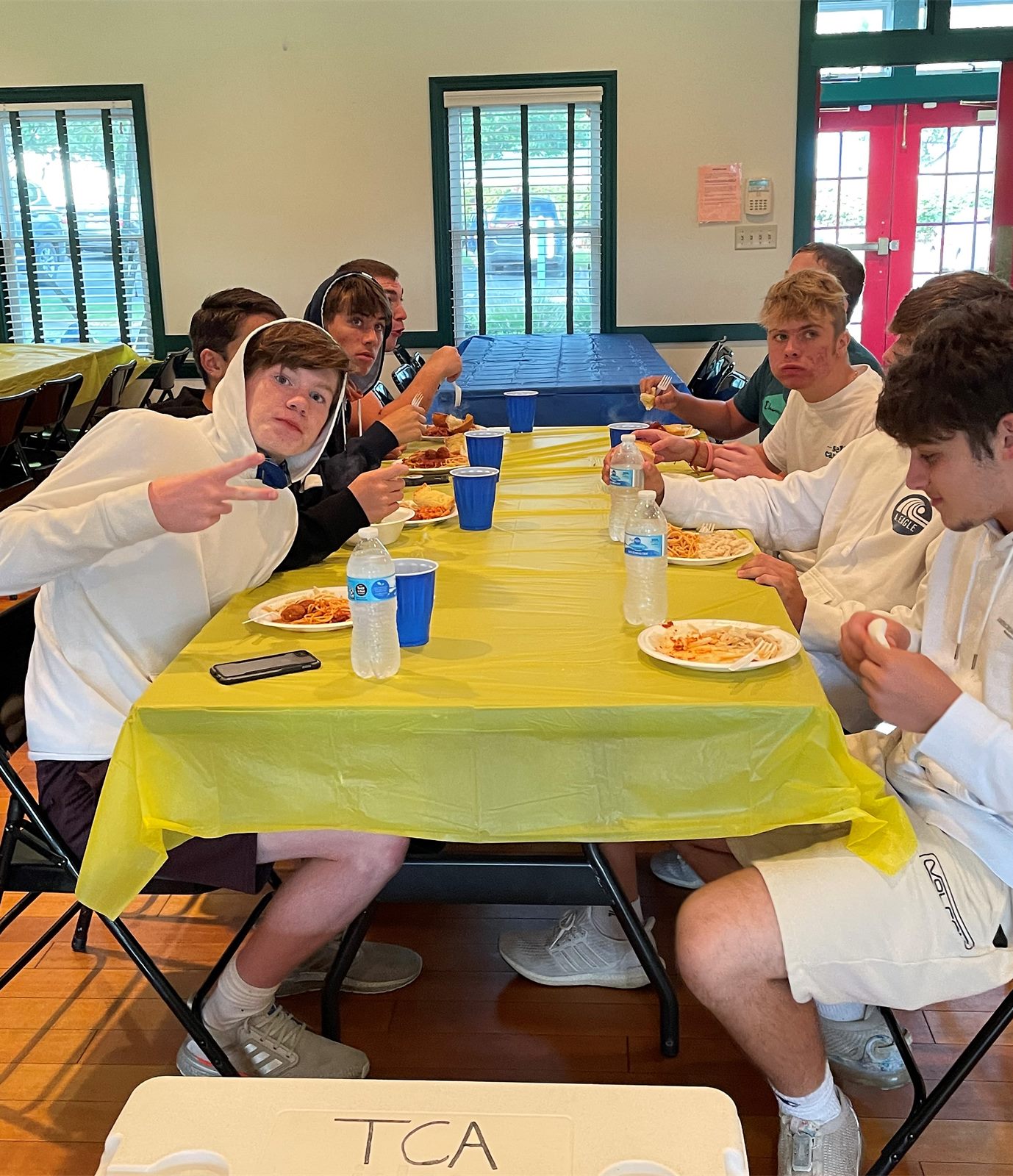 Players eating at a team spaghetti dinner