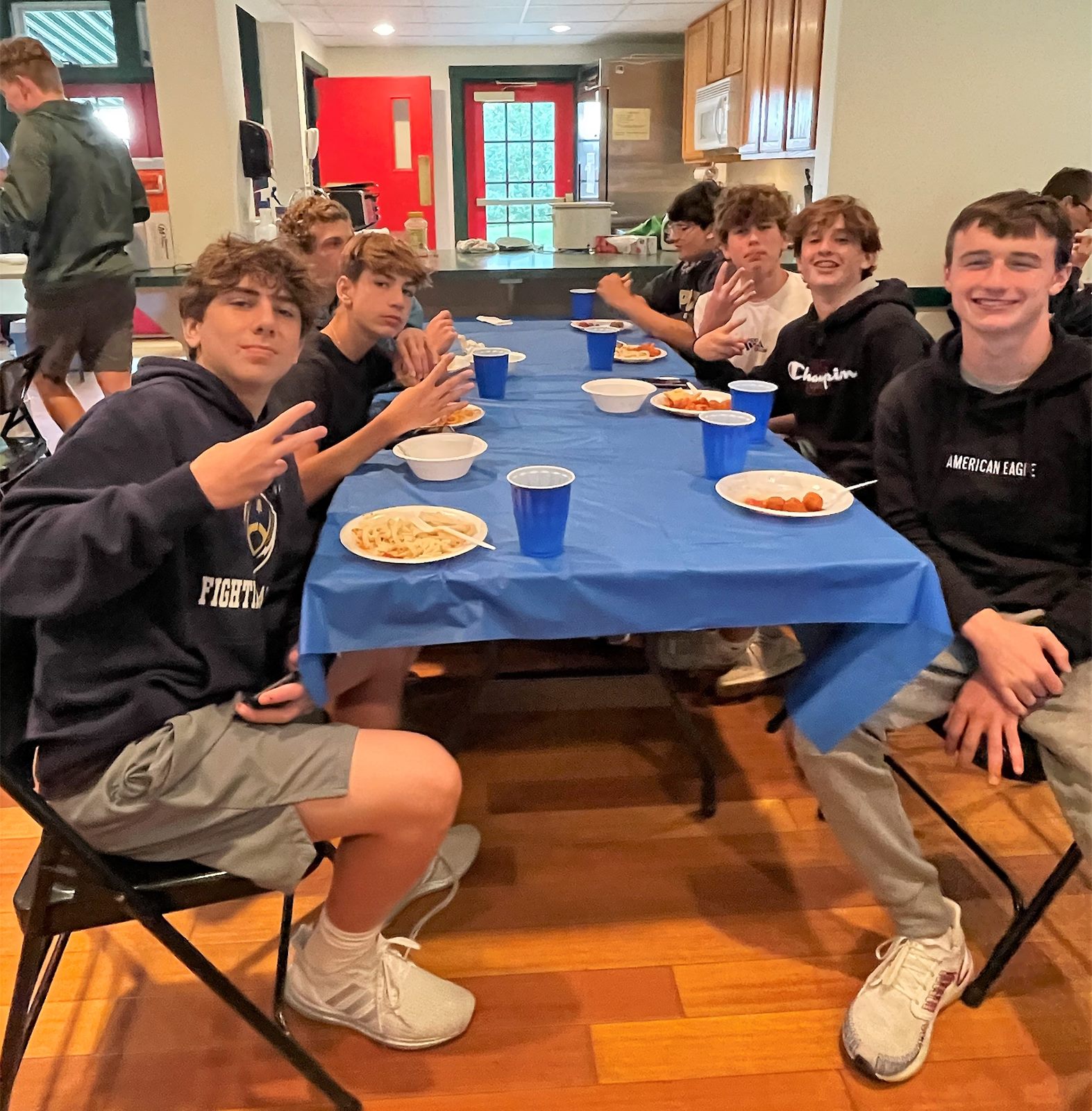 Players eating at a team spaghetti dinner
